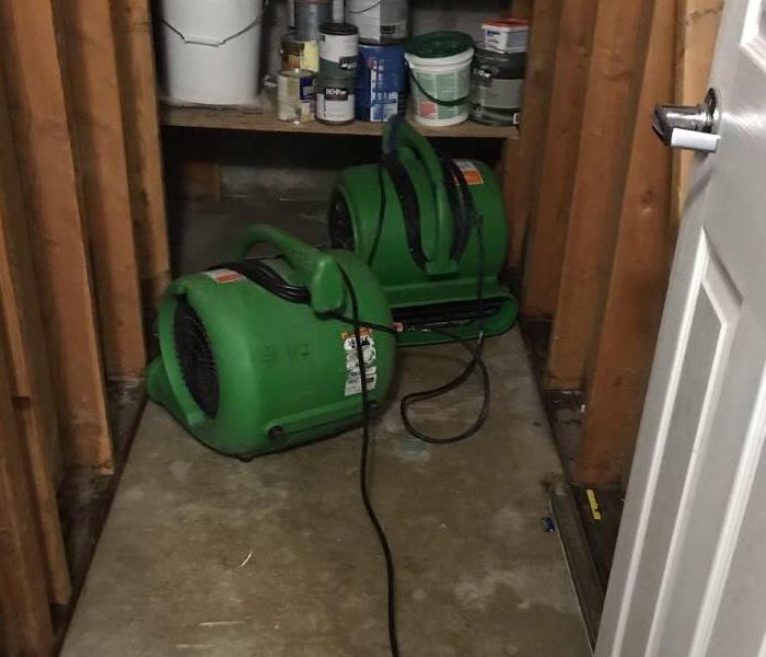 two pieces of green drying equipment in a cabinet