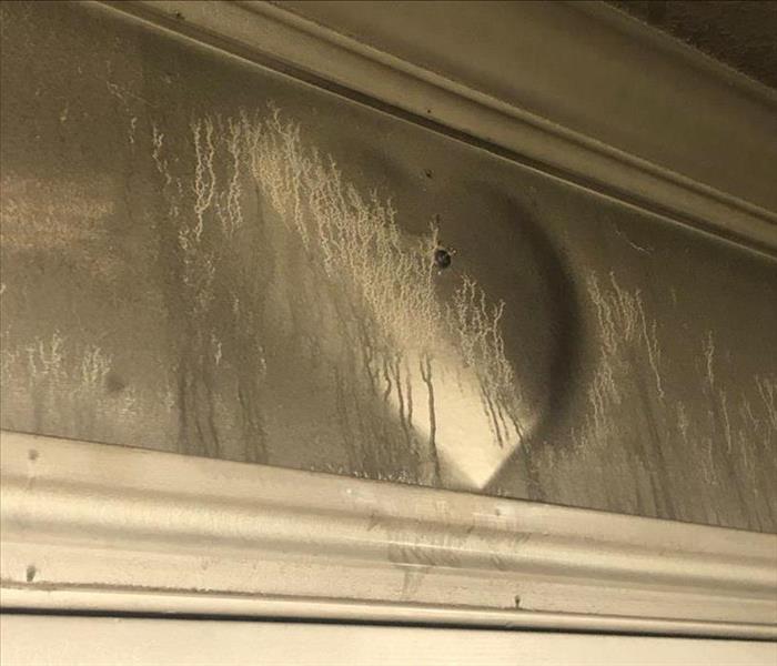 Soot damage to wall.